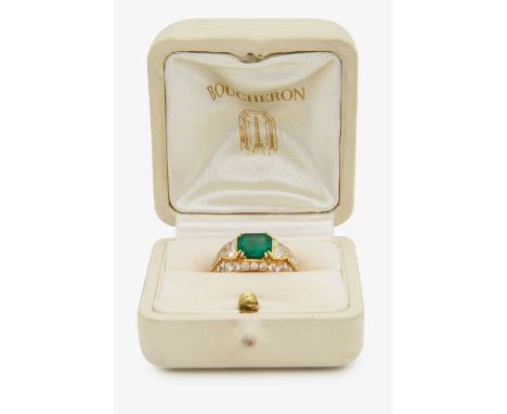 A French mid 20th century emerald and diamond-set ring by Boucheron&nbsp;centrally-set with a rectangular cut-cornered emeral