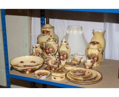 A nice collection of Aynsley Orchard Gold including lamp with shade, lidded vases, biscuit jar, lidded sugar bowl, etc.