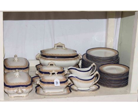 Royal Worcester Vitreous blue, gold and white dinner set with tureens and plates, approximately forty pieces.