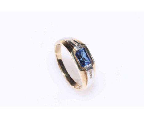 Sapphire and six stone diamond ring set in 9 carat gold.