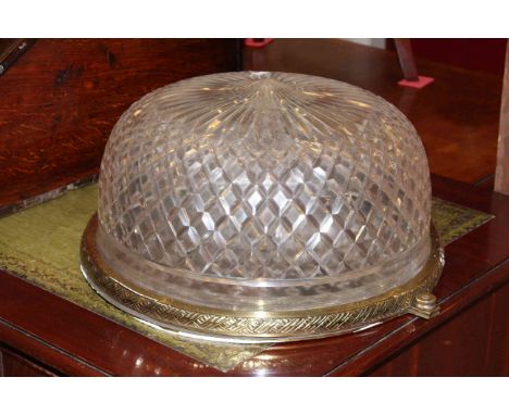 Circular cut glass ceiling light with brass fittings.
