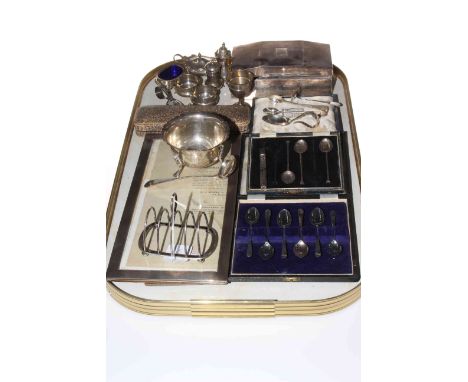 Collection of silver items including engine-turned photograph frame, condiments, toast rack, teaspoons, etc.