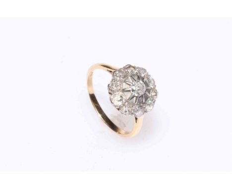 Eleven stone diamond cluster ring set in 18 carat gold and platinum, size Q.