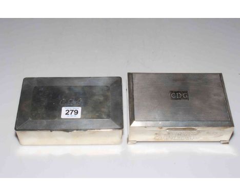 Two silver engine-turned cigarette boxes, each 17cm across.