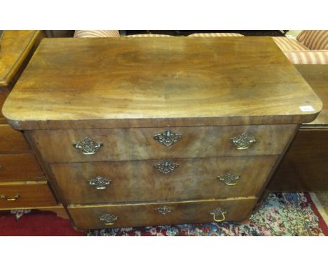 A 19th Century Continental mahogany commode of three drawers on turned legs