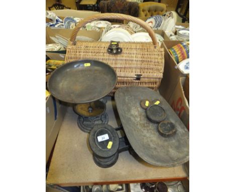 A set of cast iron Avery balance scales, a Salter's "Improved Family Scale", and a wicker picnic basket