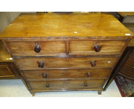 An early 19th Century mahogany chest of two short and three long graduated drawers raised on splayed bracket feet