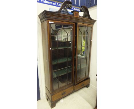 An Edwardian mahogany and satinwood banded two door glazed display cabinet with four shelves over two drawers on bracket feet
