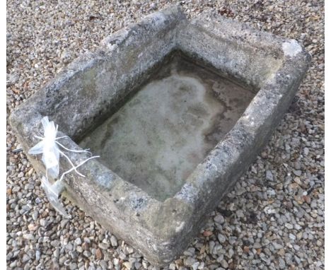 A large stoneware trough CONDITION REPORTS Approx 85 x 66cm.  Drainage pipe to one end.  Various weathering, chips and losses