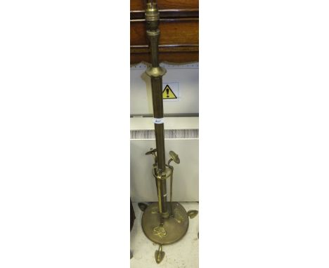 A late 19th/early 20th century Art Nouveau brass telescopic standard lamp