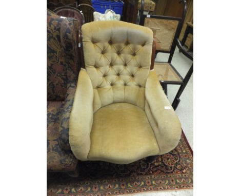 A Victorian mahogany framed button back salon chair on turned and ringed legs