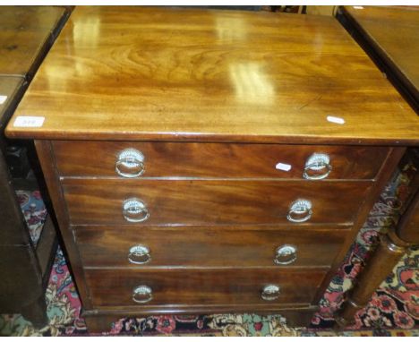 An early 19th Century mahogany dwarf chest, the plain top above two deep drawers (each as two slim drawers), raised on bracke