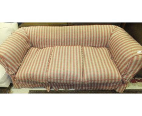 A Victorian three seat Chesterfield sofa with loose covers