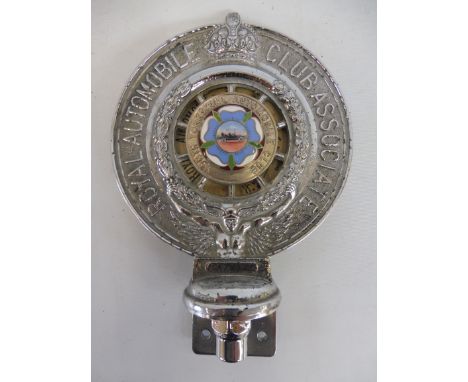 A Royal Automobile Club Associate car badge with Yorkshire Automobile Club enamel centre, no. CA 79552, celluloid disc dated 