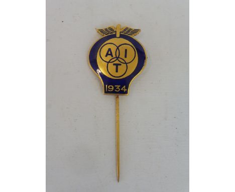 A good quality AA gilded and blue enamel tie pin bearing the letters 'AIT' 1934 (Alliance Internationale de Tourisme).