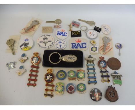 A collection of assorted RAC enamel and plastic badges including two Rally of Great Britain enamel badges with various date b