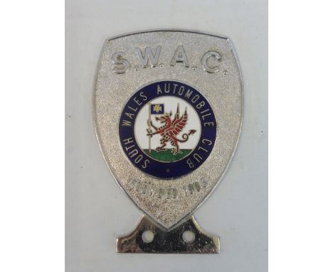 A South Wales Automobile Club (S.W.A.C.) chrome plated car badge with good enamel centre. 
