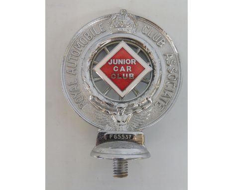 A Royal Automobile Club Associate car badge with red and white enamel centre for Junior Car Club, Type 2 Brooklands Race Trac