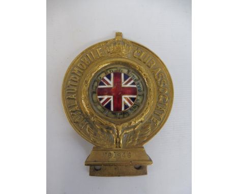 A Royal Automobile Club Associate car badge, dashboard fitting type, with correct union flag enamel centre, retouched enamel,