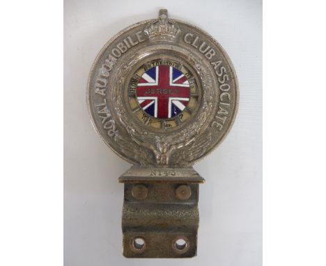 A Royal Automobile Club Associate car badge, nickel plated on brass with rare Jersey enamel union jack centre, no. N143 and s