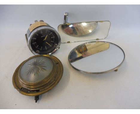 An autojumblers lot of items to include a Smiths car clock, a limousine interior light etc.