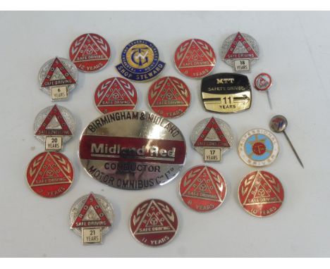 Approximately 20 bus badges. 