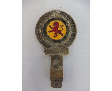 A Royal Scottish Auto Cycle Union motorcycle handlebar mounted badge type 2 with yellow and red enamel centre, repaired, the 