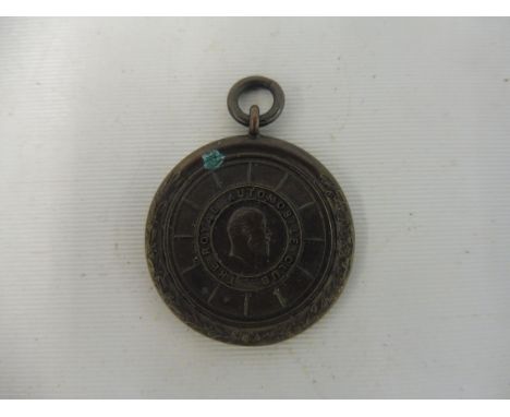 A Royal Automobile Club circular pendant, awarded to Clarance Plummer, holder of the R.A.C. Driving and Mechanical Proficienc