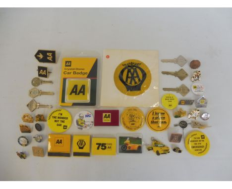 A selection of AA badges, enamel and plastic, AA keys, an early plastic window badge etc.