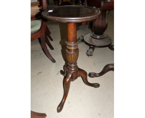 A Georgian style mahogany circular wine table on tripod base