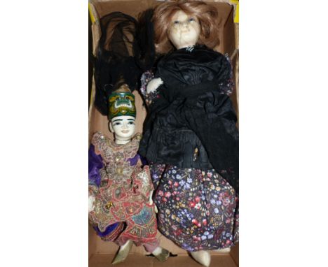 A large wax doll dressed in the Victorian style (a.f.); an oriental puppet