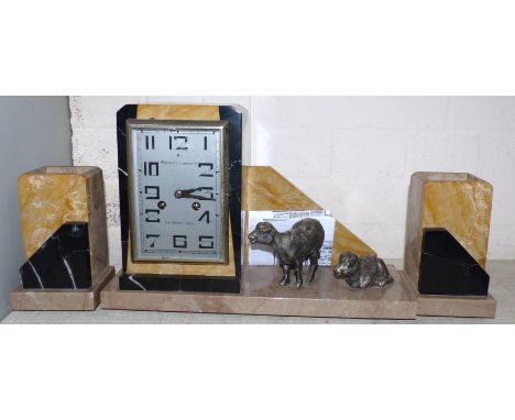 An Art Deco coloured alabaster 3 piece clock garniture, the central clock with 2 silvered sheep, by Perrot-Commein, with copy