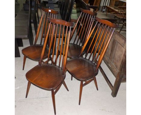A set of 4 Ercol stick back dining chairs; a stick back armchair (no cushions)