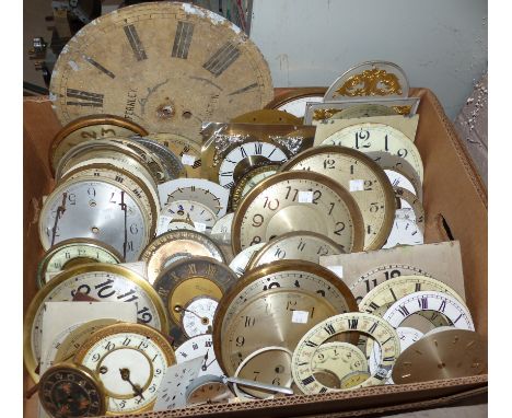 A large selection of clock faces and backs