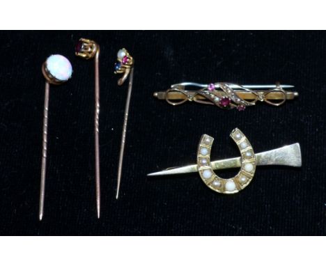 A Victorian stick pin set with opal; 4 others