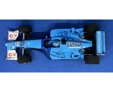 Jenson Button and Mike Gascoyne signed 1:18 scale model car. In original box. Good condition. All autographs come with a Cert