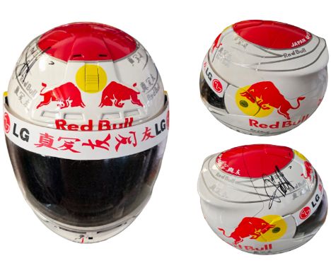 Sebastian Vettel signed Red Bull Japan 2010 replica helmet size large. Good condition. All autographs come with a Certificate