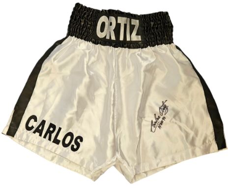 Carlos Ortiz signed white and black personalised boxing shorts. Carlos Ortiz (September 9, 1936 - June 13, 2022) was a Puerto