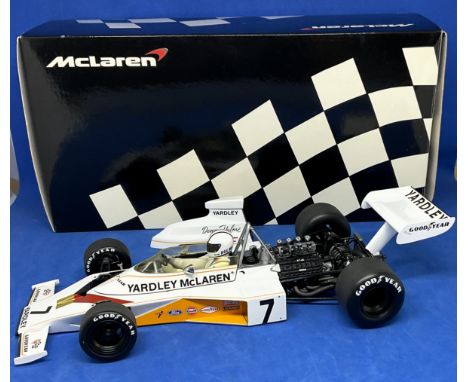 D Hulme Mclaren Ford M23 1973 1:18 scale model car. In original box. UNSIGNED. Good condition. All autographs come with a Cer