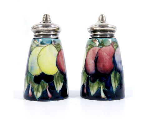 William Moorcroft, a pair of Wisteria salt and pepper pots, circa 1925, conical barrel form, with sterling silver caps, impre