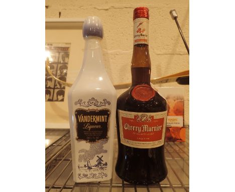 Two bottles of liqueur; Vandermint 26 3/4 fl oz and Cherry Marnier 700ml   CONDITION REPORT:  This lot is sealed with content