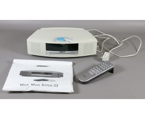 A Bose Wave music system 111 with remote control and manual { in office }