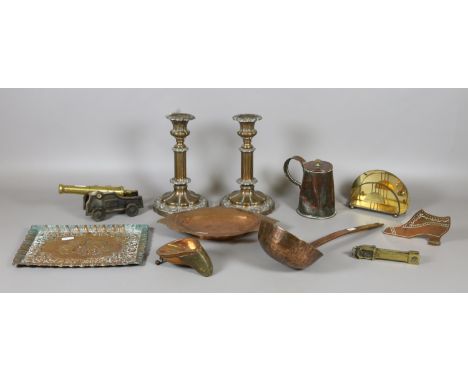 A collection of brass and copper items to include ladle, engraved dish, relief plaque, flask, candlesticks, etc.