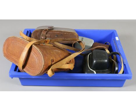 A vintage Kodak camera in case, a cased Halina Paulette electric camera, a cased set of Aloma 7 x 50 binoculars and camera ac