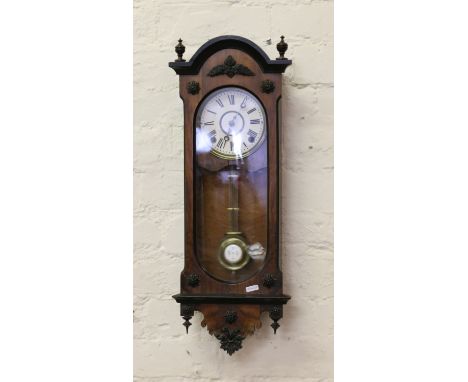 A 19th century walnut cased eight day spring driven Vienna wall clock. 