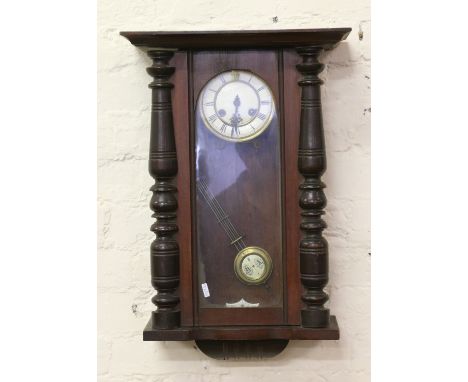 A 19th century Vienna two train wall clock striking on a gong.