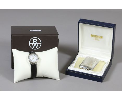 A boxed Ronson cigarette lighter along with a boxed Raymond Weil wristwatch.