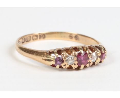 An 18ct gold ruby and diamond five stone ring, assayed Birmingham 1939 UK size N1/2.