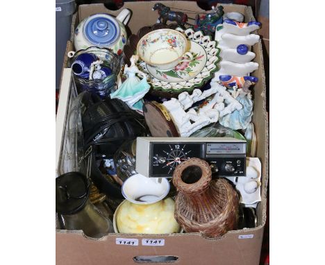 A box of miscellaneous including a vintage retro Bush radio alarm clock, a Royal Doulton figurine, tourist wares, glasswares,