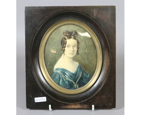 An early Victorian framed watercolour portrait miniature of a woman with ringlets and wearing a blue dress, 14.5cm x 11.5cm. 